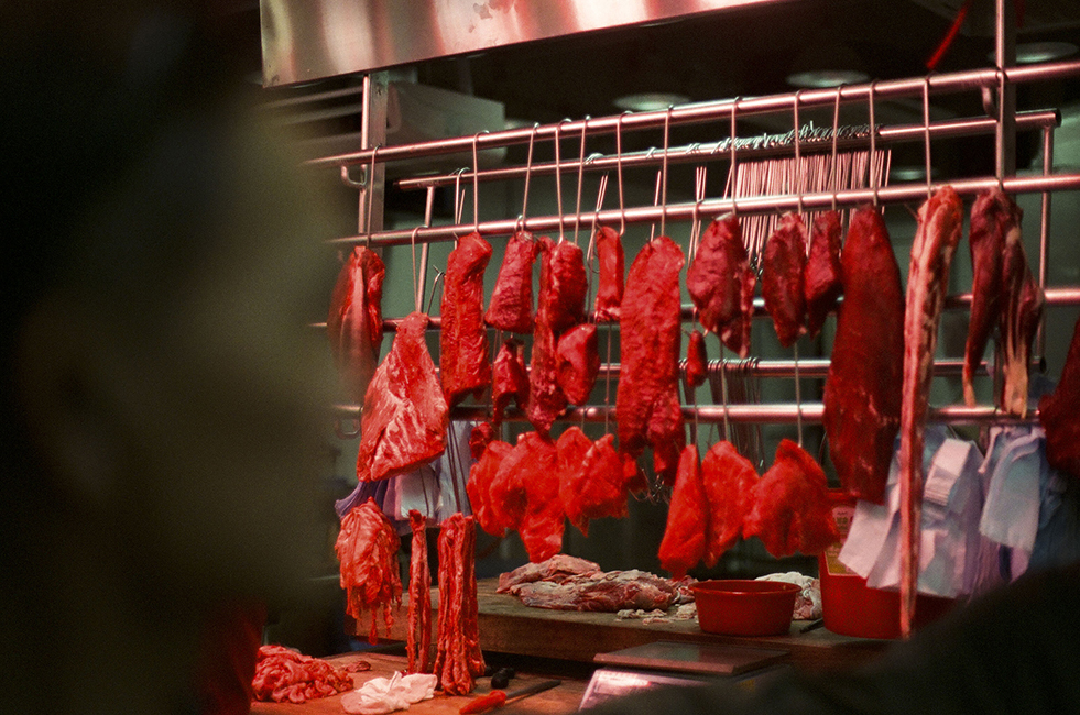 <h4><i>a local butcher shop</i></h4>
					<h4><b> Sham Shui Po, Hong Kong <br> Nikon FM2 [35mm] <br> February 2019 </b></h4>
					<h4> A common sight around Hong Kong, with its distinct red lamps giving everything around it a red tint. These photographs of Hong Kong are some that remind me most the of home. </h4>