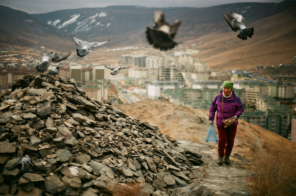 <h4><i> овөө </i></h4>
					<h4><b> Ulaanbaatar, Mongolia <br> Nikon FM2 [35mm] <br> October 2017 </b></h4>
					<h4> Өвөө (övöö) means grandfather in Mongolian and is the name for a sacred stone heap. Offerings of food or candy are given (hence the pigeons) every time the altar is circled ‘sunwise’, three times, but the best offerings are stones. </h4>