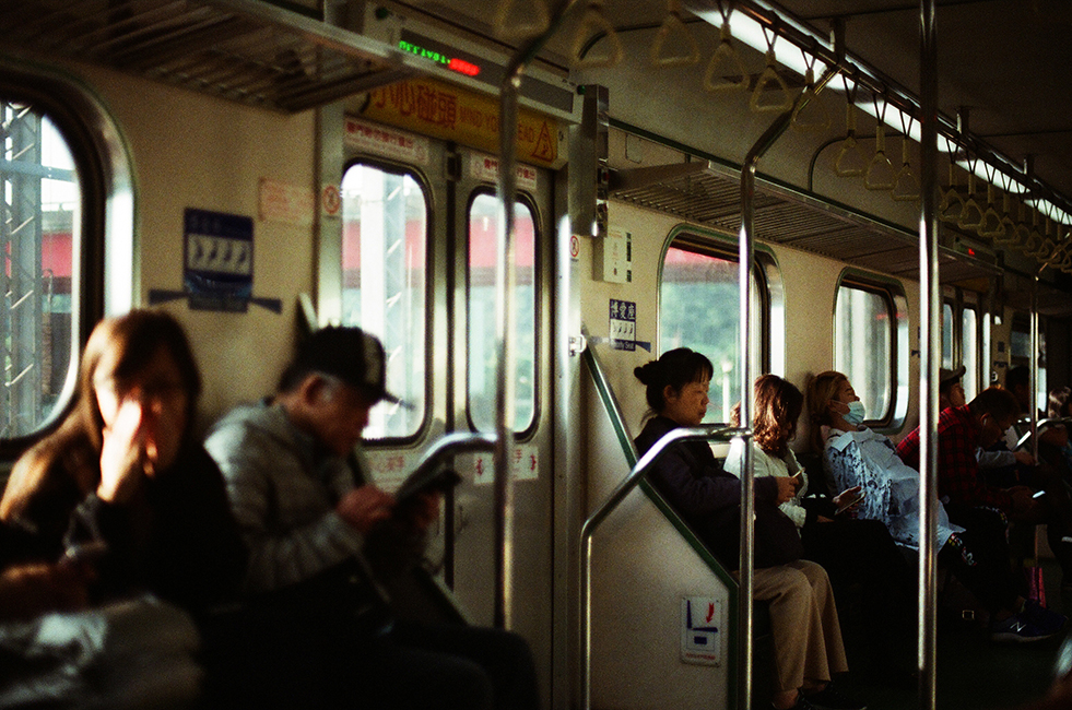 <h4><i>train ride in the afternoon sun</i></h4>
					<h4><b> Taipei, Taiwan <br> Nikon FM2 [35mm] <br> April 2019 </b></h4>
					<h4> Yet another photograph of public transit with sun shining through the windows. There is something super relaxing about the combination of taking public transit with no destination in mind and golden hour.</h4>